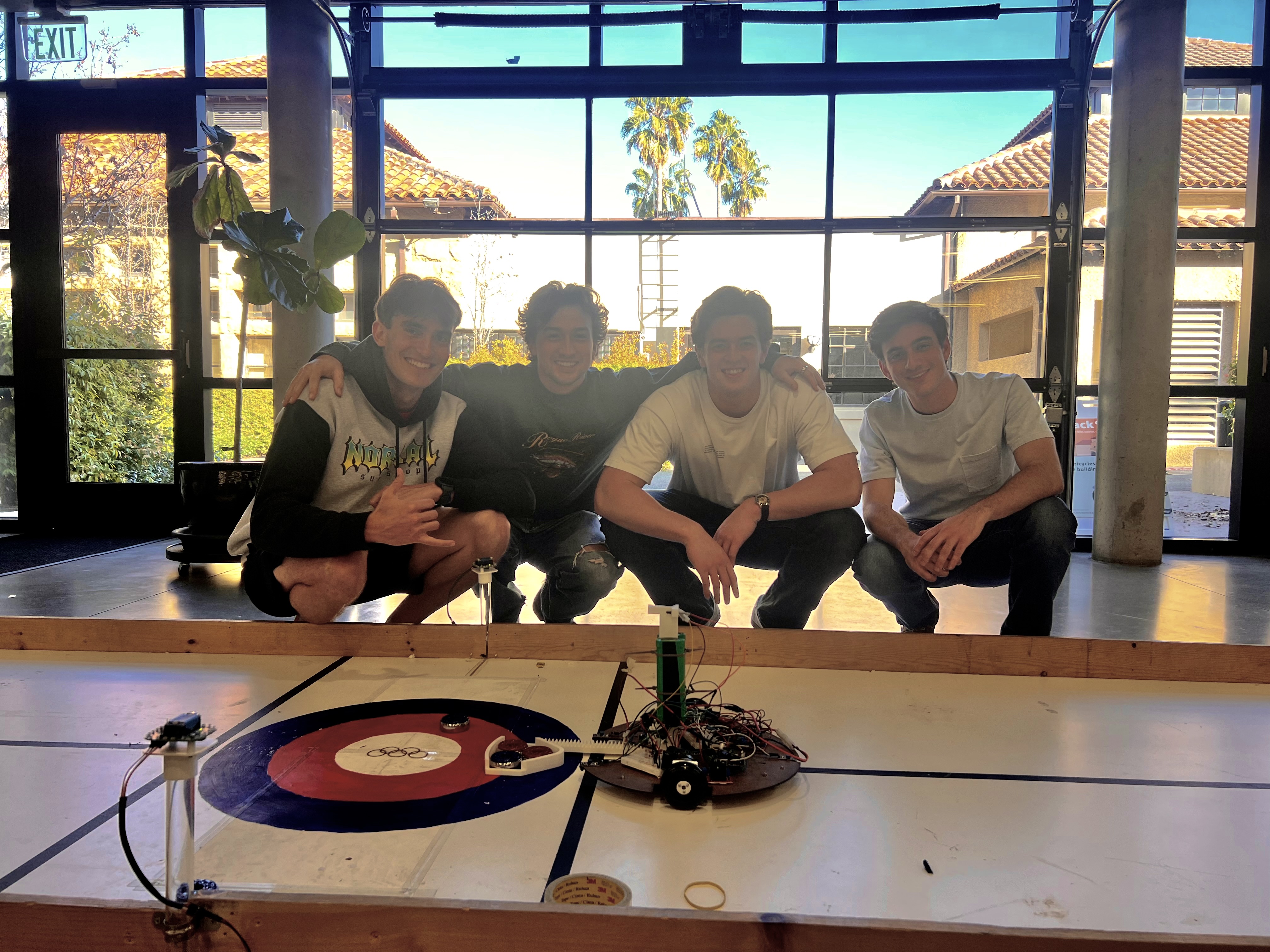 Canada Curling Team with their robot